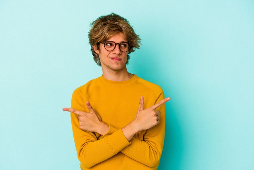 Points sideways is trying to choose between two options.