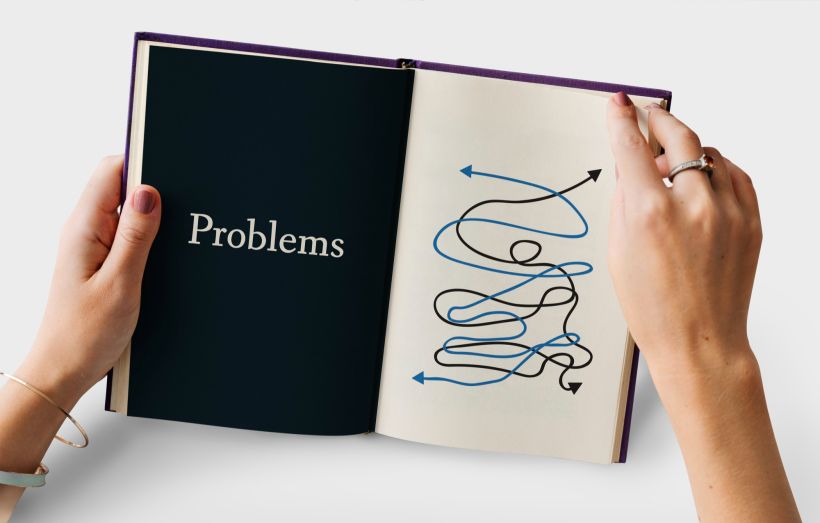 A book with a problem written on it and confusing arrows.