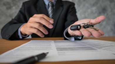 Handing over car keys and paperwork. Find out how long a title transfer takes in California