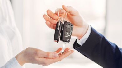 Passing car keys to a buyer